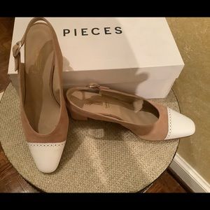 Leather and suede sling back shoes.